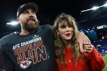 Travis Kelce of the Kansas City Chiefs celebrates with Taylor Swift after defeating the Baltimore Ravens in the AFC Championship Game at M&T Bank Stadium on January 28, 2024 in Baltimore, Maryland.