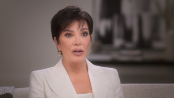 Kris Jenner wears white while speaking to the camera.